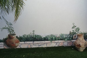 ציורי קיר תלת מימד של כד, אבנים ופרחים